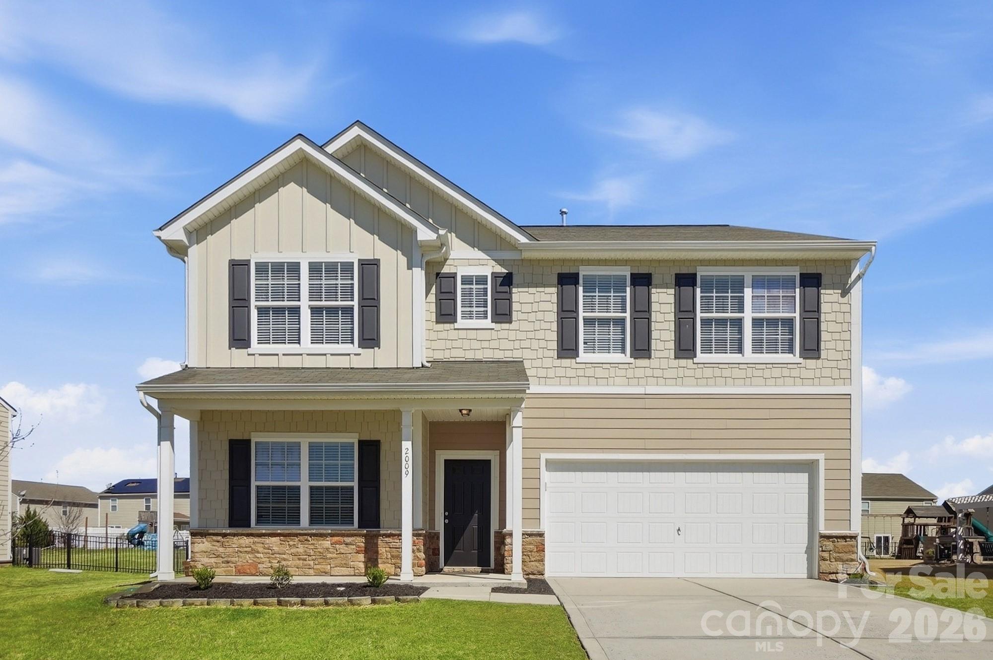 2009 Houndscroft Road Indian Trail, NC 28079 - Photo 2 of 25 a front view of a house with a yard