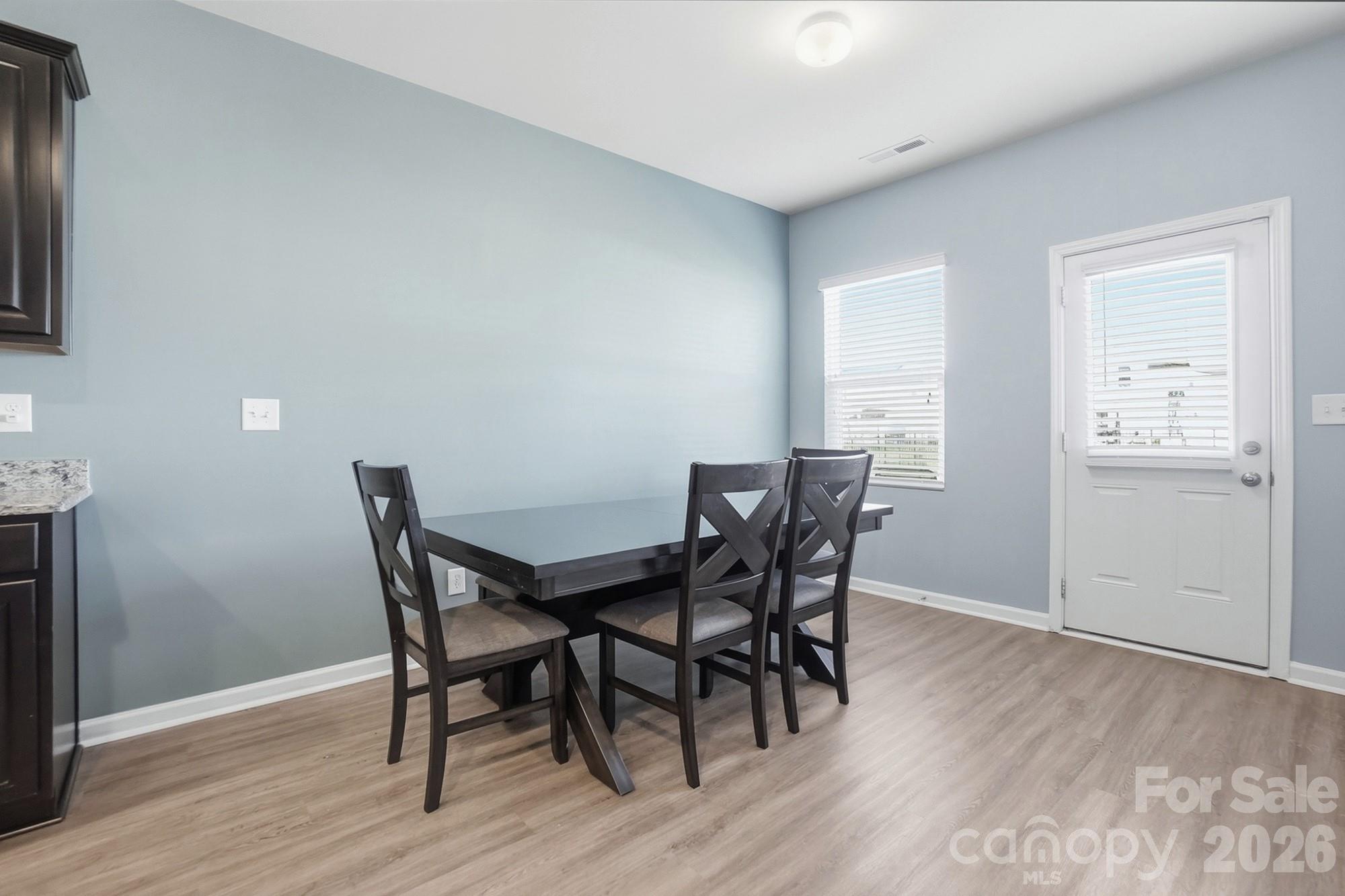 2009 Houndscroft Road Indian Trail, NC 28079 - Photo 6 of 25 a view of a dining room with furniture and wooden floor