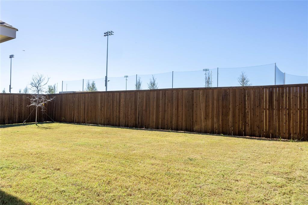 419 Revolution Road Fate, TX 75189 - Photo 12 of 19 View of fenced backyard