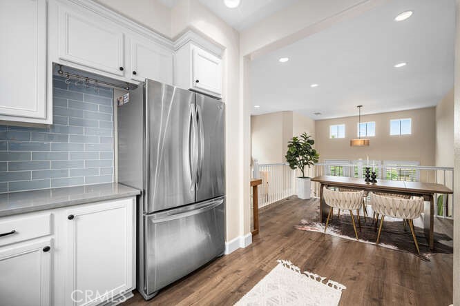 46 Hinterland Way Ladera Ranch, CA 92694 - Photo 16 of 46 a kitchen with stainless steel appliances a refrigerator stove microwave and cabinets