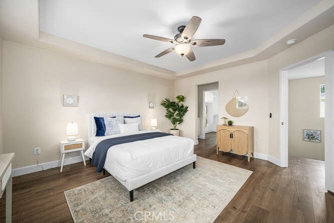 46 Hinterland Way Ladera Ranch, CA 92694 - Photo 23 of 46 a bedroom with a large bed and a chandelier