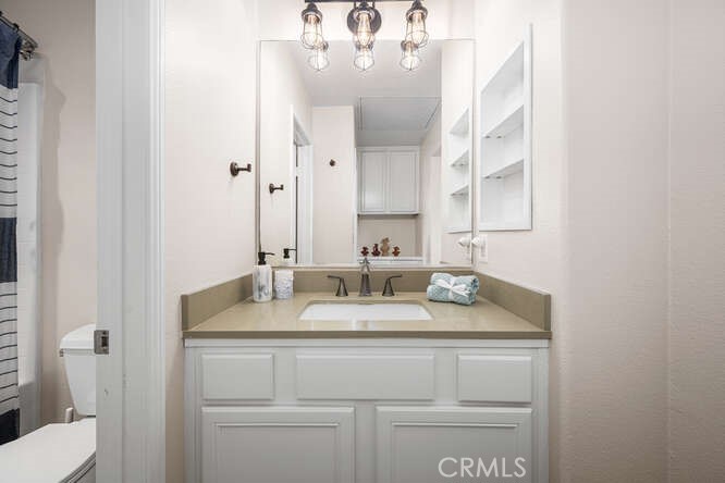 46 Hinterland Way Ladera Ranch, CA 92694 - Photo 27 of 46 a bathroom with a sink and a mirror