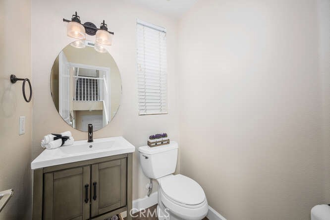 46 Hinterland Way Ladera Ranch, CA 92694 - Photo 5 of 46 a bathroom with a toilet sink and mirror