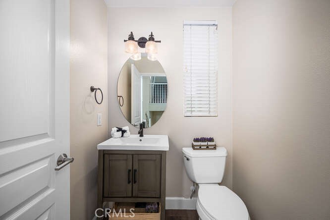 46 Hinterland Way Ladera Ranch, CA 92694 - Photo 6 of 46 a bathroom with a toilet sink and mirror