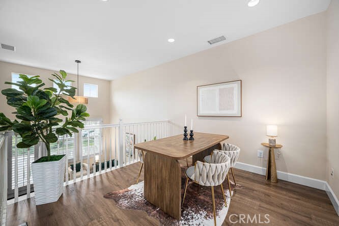 46 Hinterland Way Ladera Ranch, CA 92694 - Photo 7 of 46 a dining room with furniture potted plants and wooden floor
