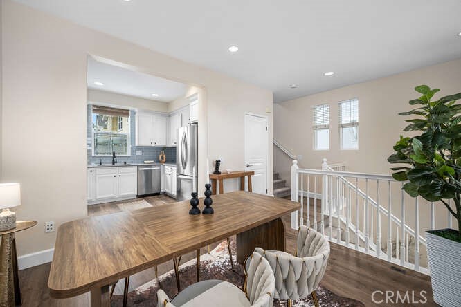 46 Hinterland Way Ladera Ranch, CA 92694 - Photo 9 of 46 a view of a dining room with furniture and a potted plant
