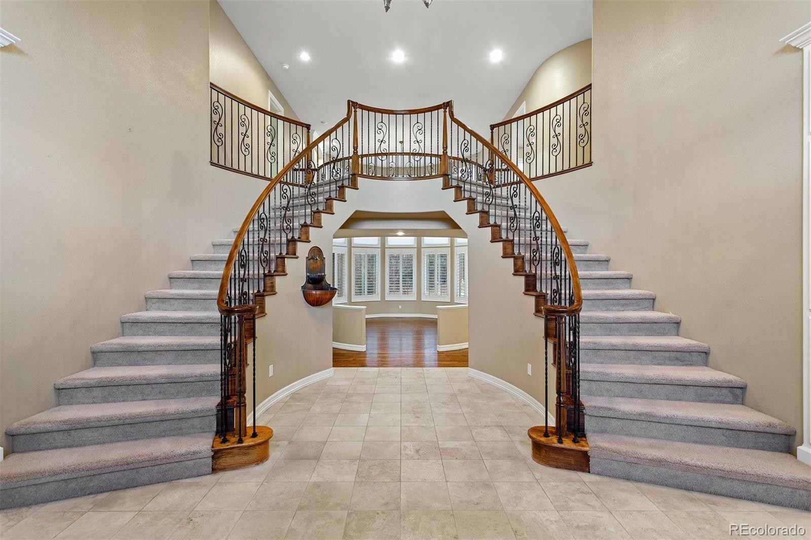 7125 Polo Ridge Drive Littleton, CO 80128 - Photo 13 of 25 a view of entryway livingroom and hall with a front door