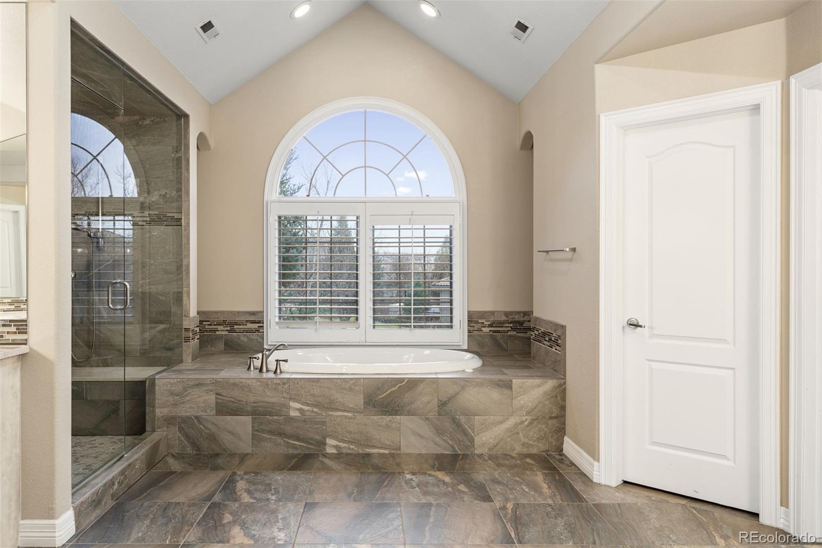 7125 Polo Ridge Drive Littleton, CO 80128 - Photo 19 of 25 a living room with furniture and a large window
