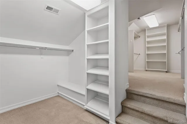a view of an empty walk in closet