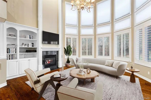 a living room with furniture fireplace and a flat screen tv
