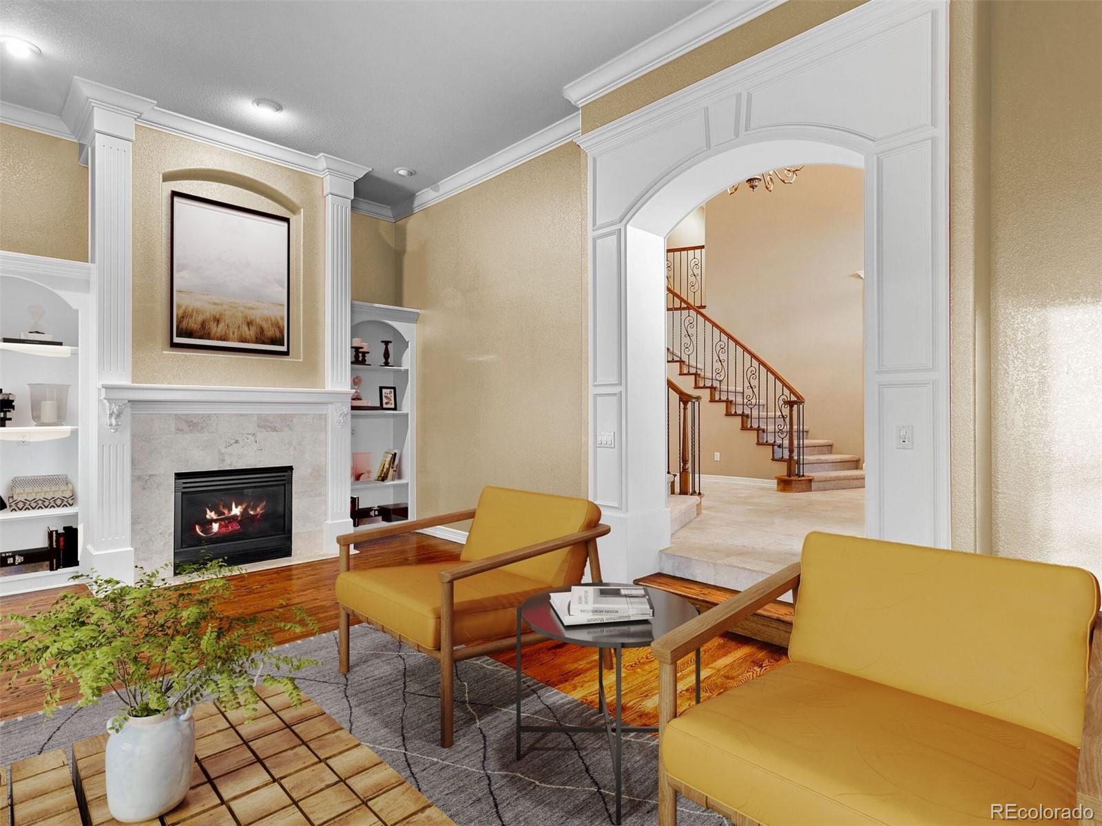 7125 Polo Ridge Drive Littleton, CO 80128 - Photo 8 of 25 a living room with furniture a fireplace and a table