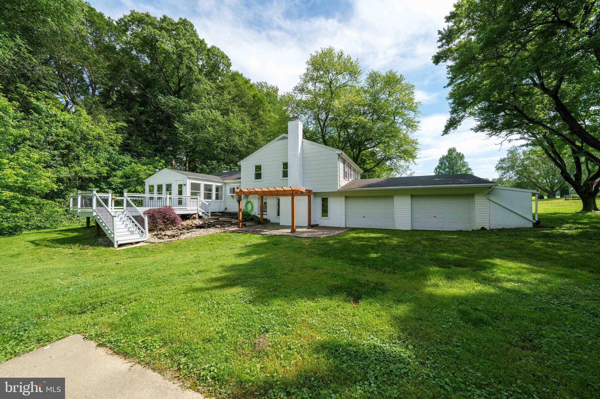 413 Buck Toe Road Avondale, PA 19311 - Photo 54 of 70 a view of a house with a big yard next to a road