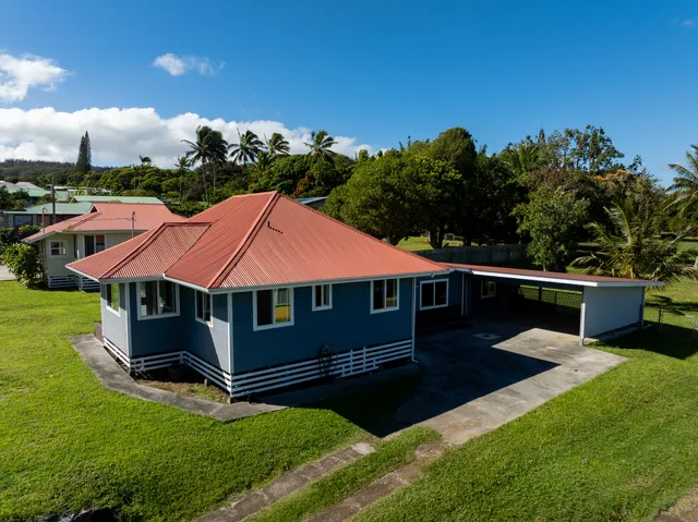 a aerial view of a house with table and chairs