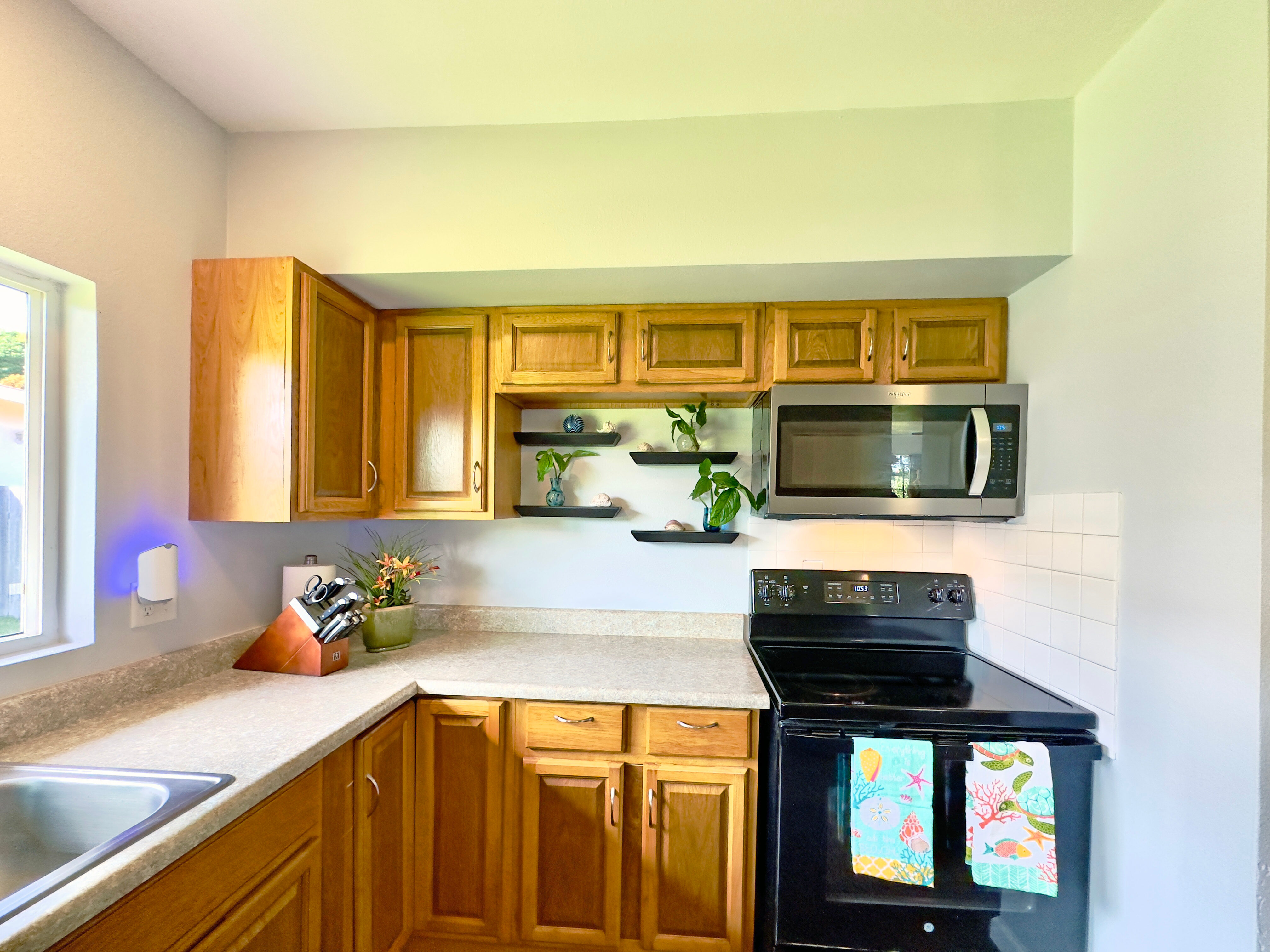 54-2461 Kynnersley Road Kapaau, HI 96755 - Photo 14 of 30 a kitchen with stainless steel appliances a sink stove and microwave