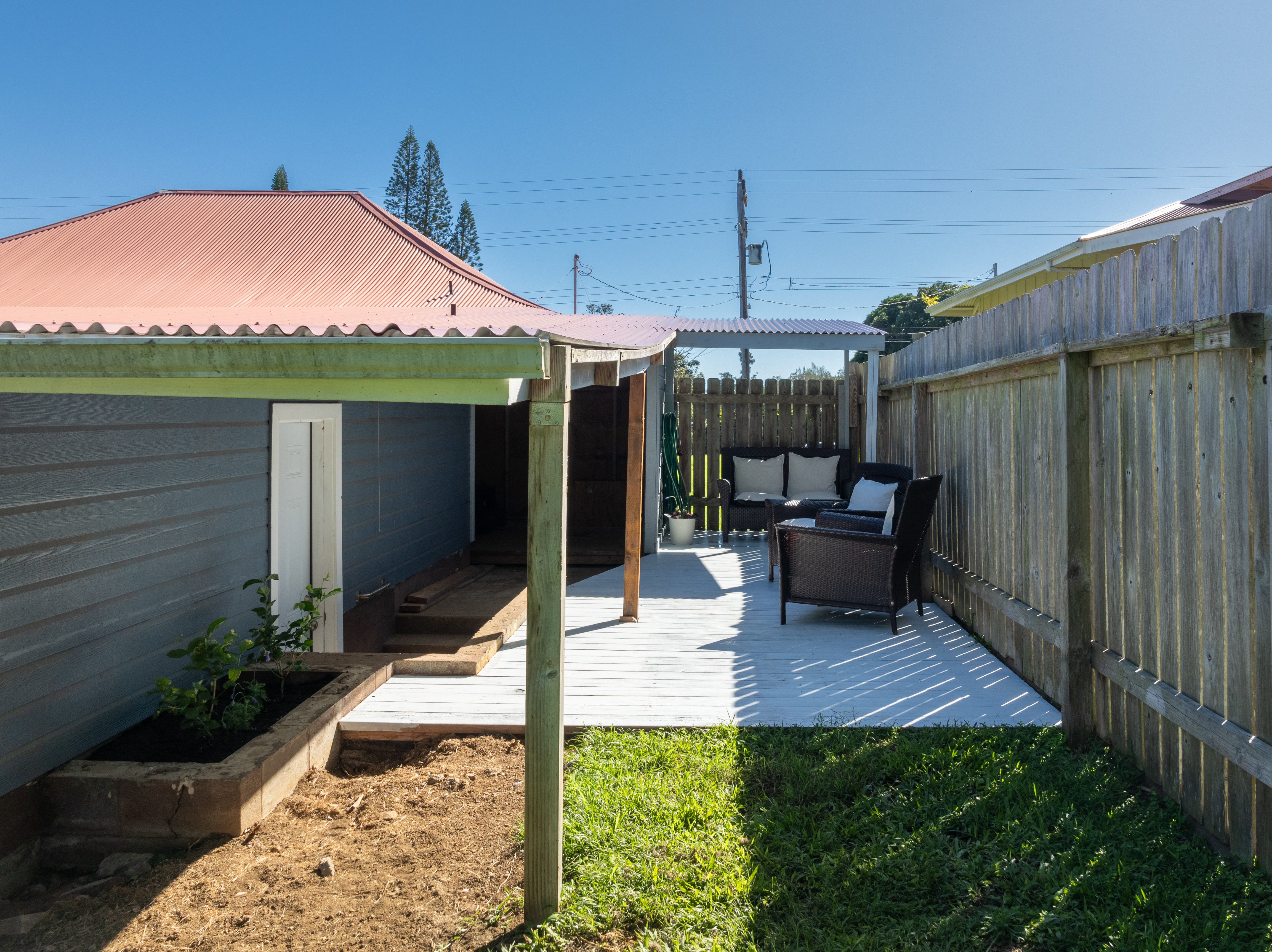 54-2461 Kynnersley Road Kapaau, HI 96755 - Photo 16 of 30 a patio with table and chairs