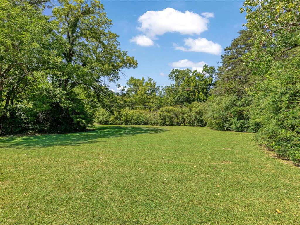 2901 Simpson Stuart Road Dallas, TX 75241 - Photo 6 of 14 a view of a field with an trees