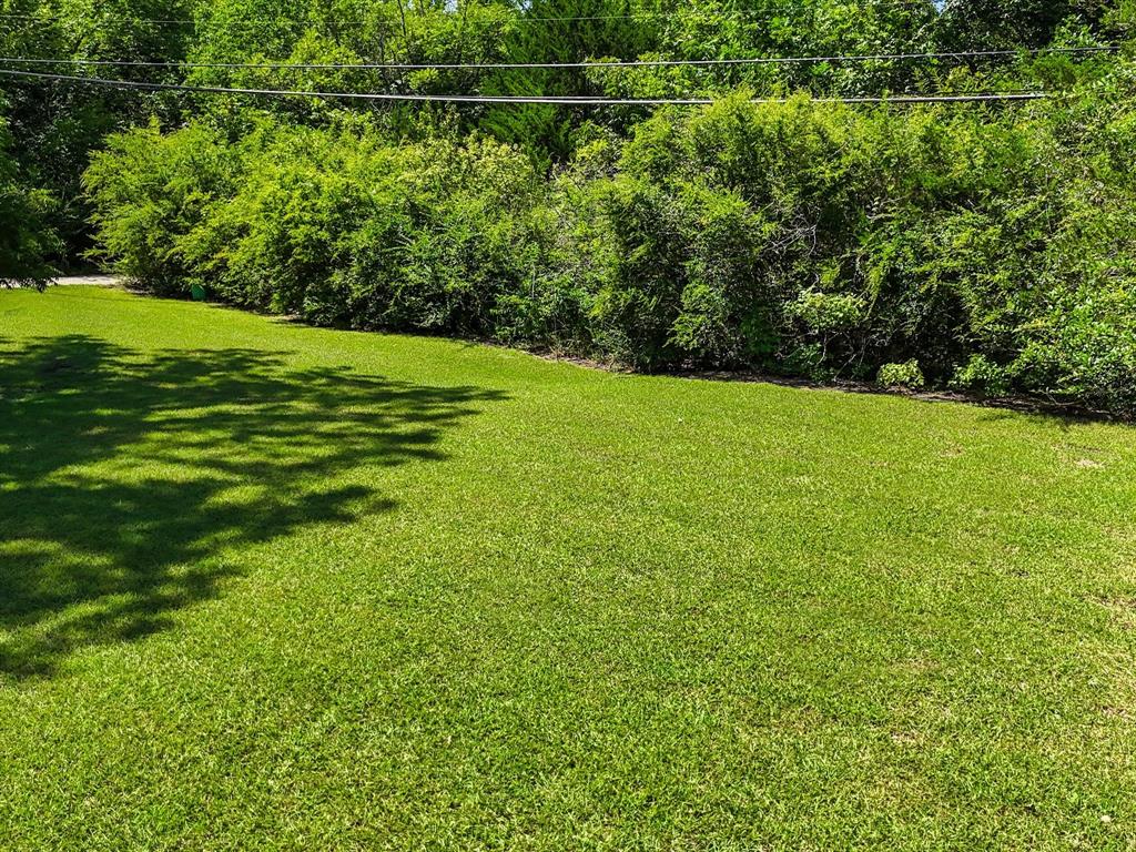2901 Simpson Stuart Road Dallas, TX 75241 - Photo 8 of 14 a view of a field with a tree