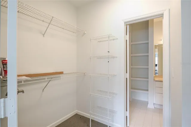 a view of storage and utility room with racks on the wall