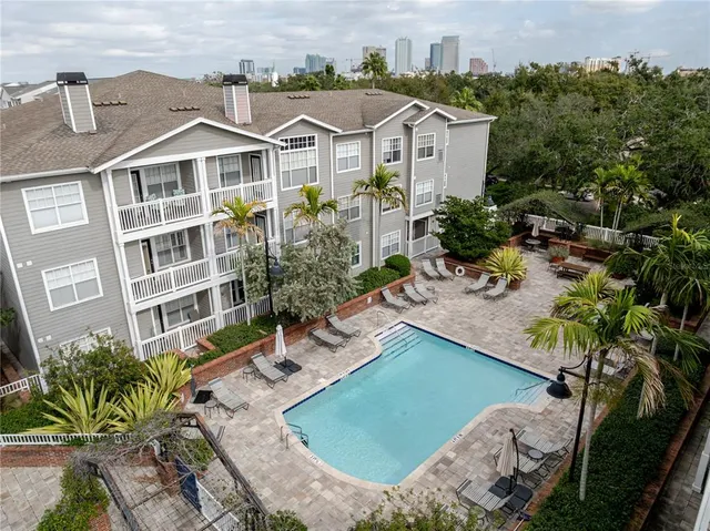 a view of a house with a garden and plants