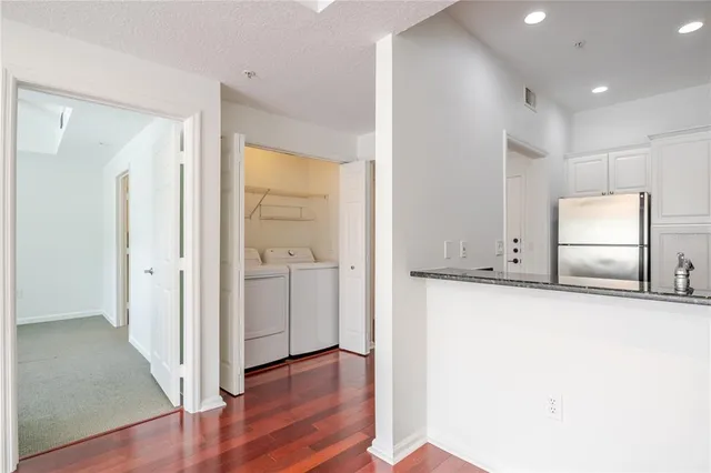 a view of a kitchen cabinets and wooden floor
