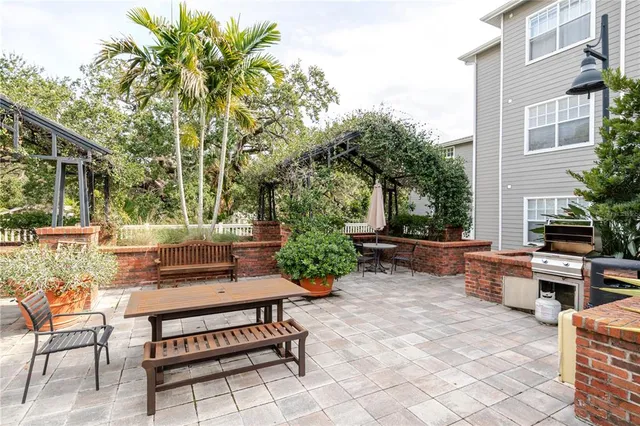 a view of a backyard with sitting area