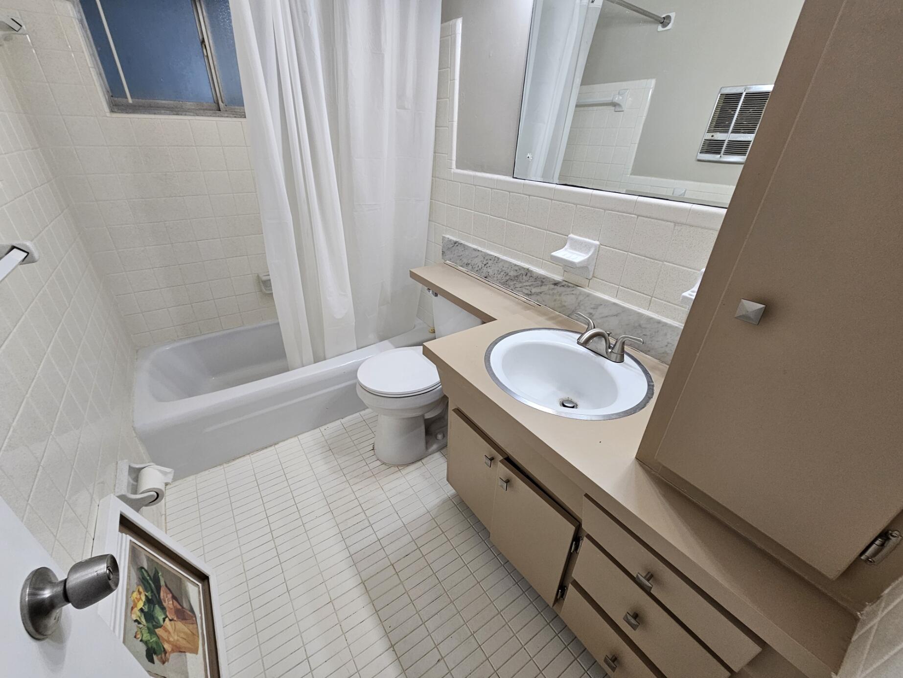 722 Ridge Road, Unit 10 Lantana, FL 33462 - Photo 11 of 13 a bathroom with a sink toilet and shower