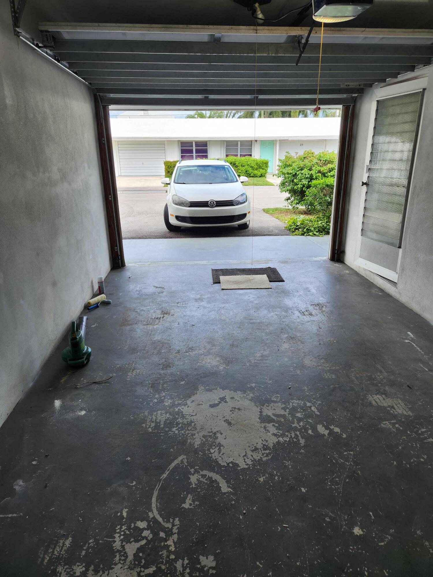 722 Ridge Road, Unit 10 Lantana, FL 33462 - Photo 2 of 13 a view of car parked in garage