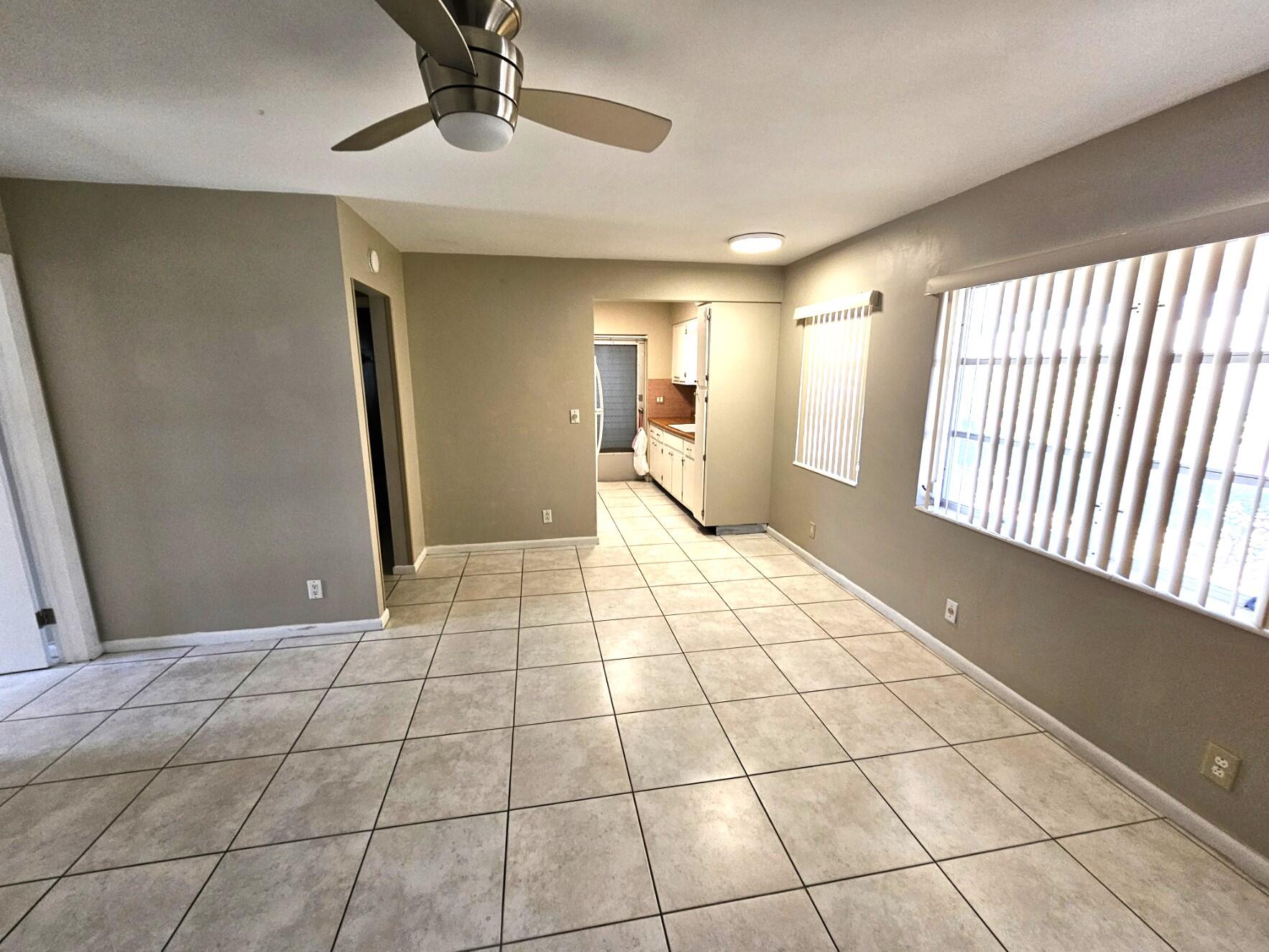 722 Ridge Road, Unit 10 Lantana, FL 33462 - Photo 4 of 13 a view of an empty room and window