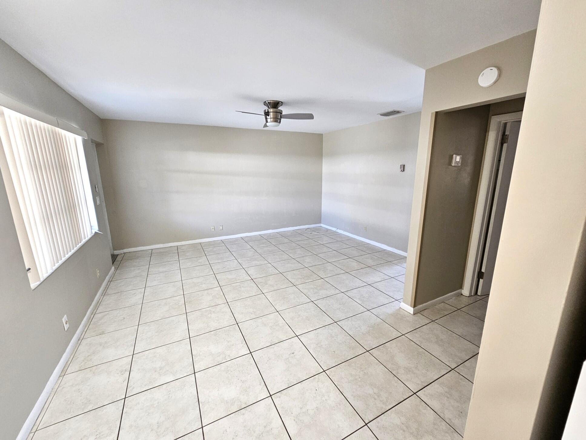 722 Ridge Road, Unit 10 Lantana, FL 33462 - Photo 5 of 13 a view of an empty room and window