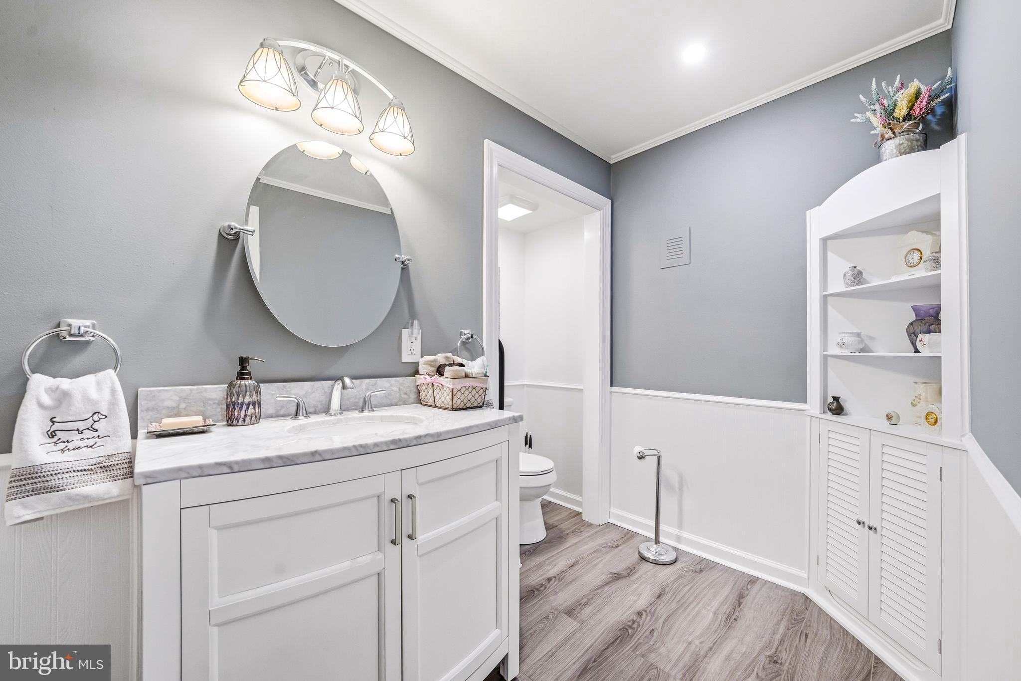 400 Witley Road Wynnewood, PA 19096 - Photo 11 of 38 a en suite bathroom with a double vanity sink a mirror and a shower