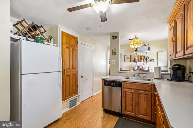 a kitchen with stainless steel appliances granite countertop a sink and cabinets