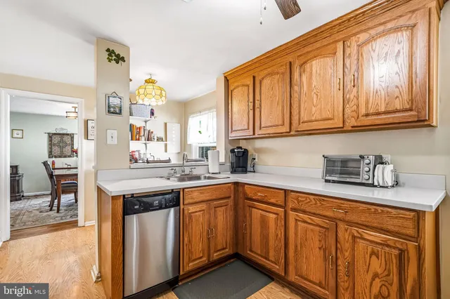a kitchen with stainless steel appliances granite countertop a stove and cabinets