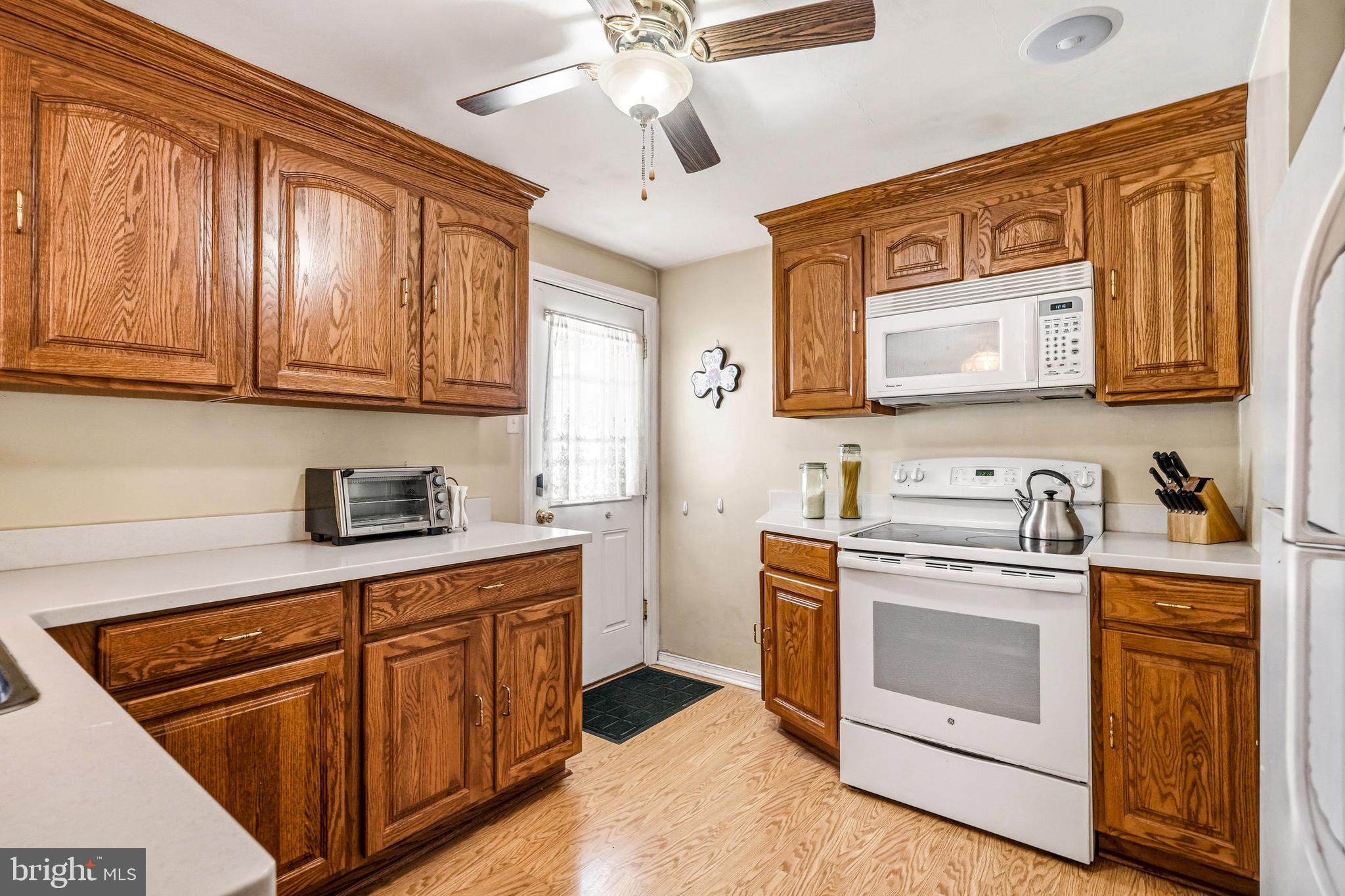 400 Witley Road Wynnewood, PA 19096 - Photo 18 of 38 a kitchen with stainless steel appliances granite countertop a stove and cabinets