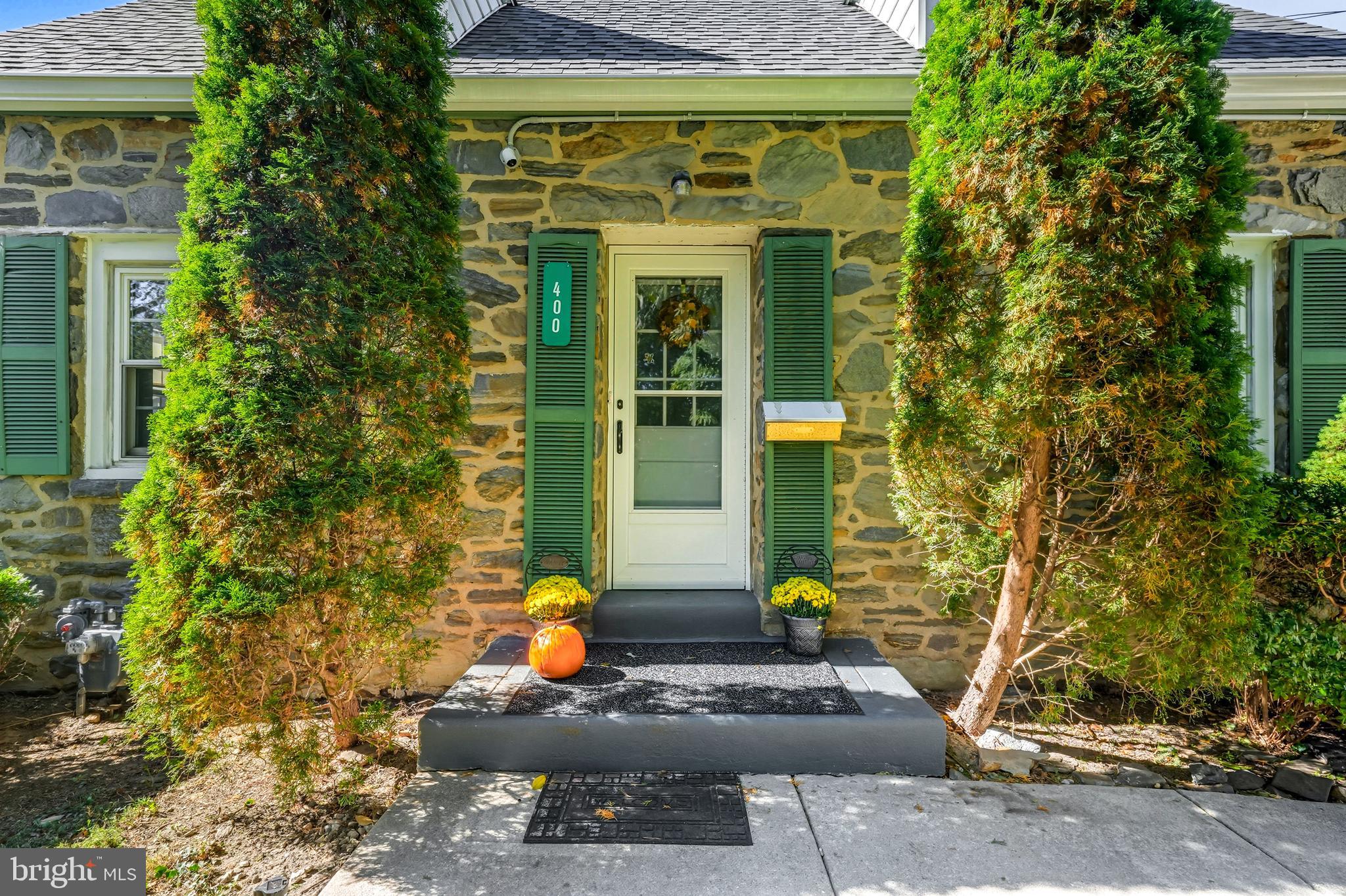 400 Witley Road Wynnewood, PA 19096 - Photo 2 of 38 a front view of a house with a yard