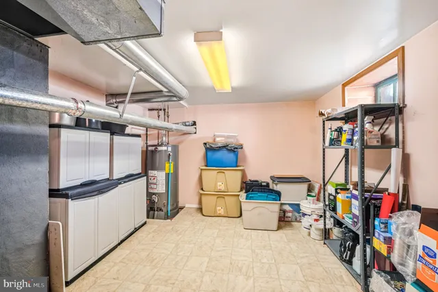 a utility room with a refrigerator and washer
