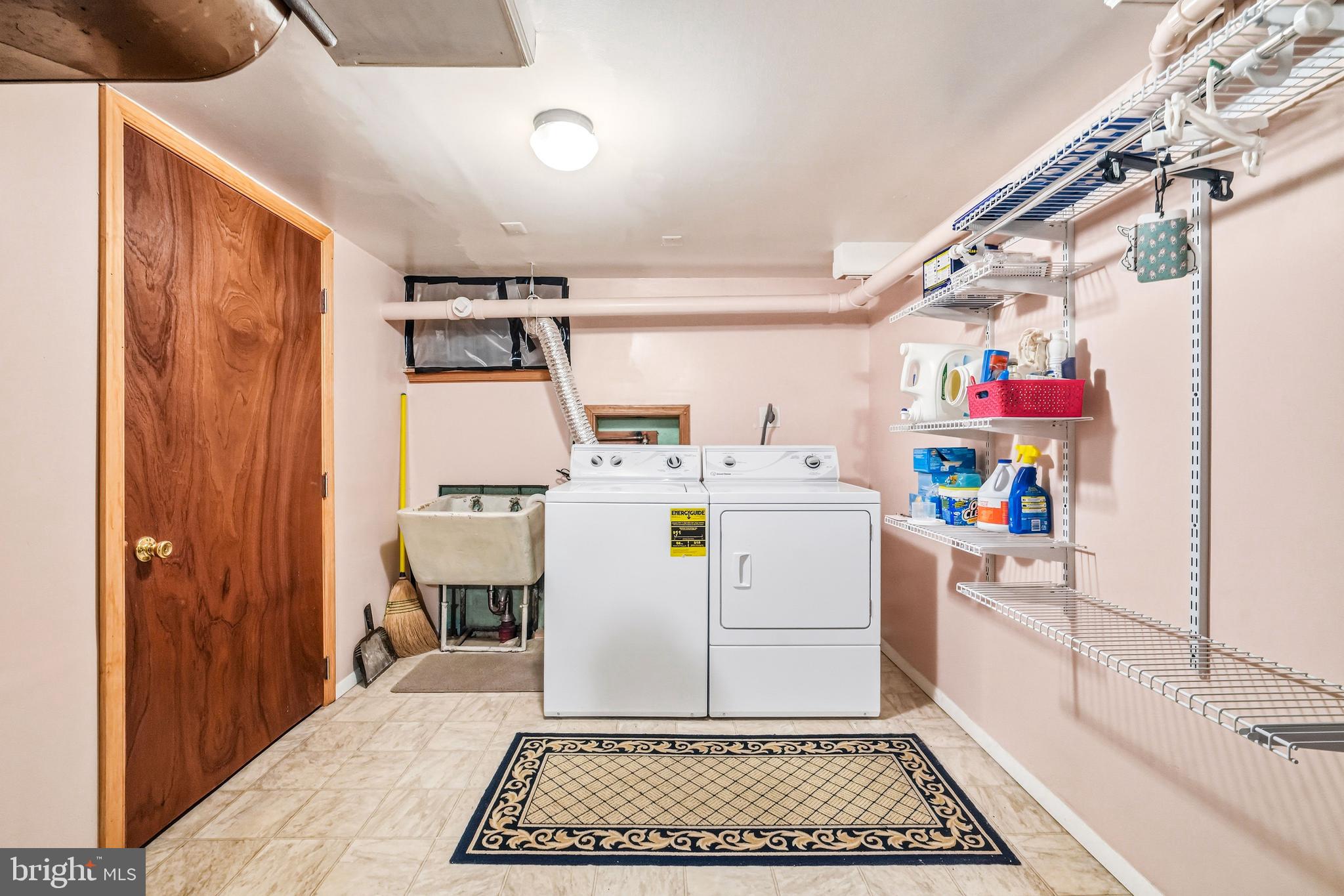 400 Witley Road Wynnewood, PA 19096 - Photo 28 of 38 a utility room with a refrigerator and washer