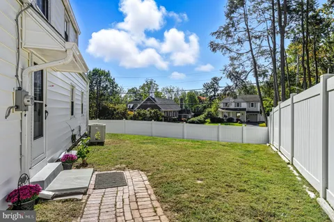 a view of a backyard of the house