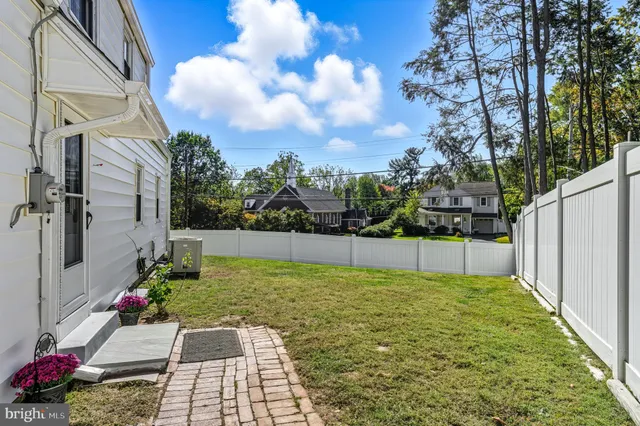 a view of a backyard of the house