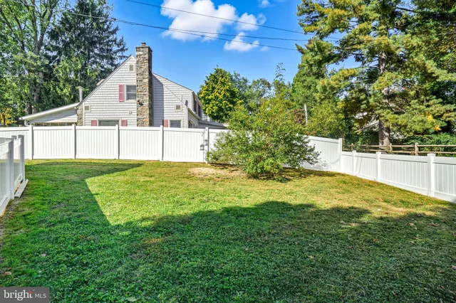 a view of a mini house with a yard