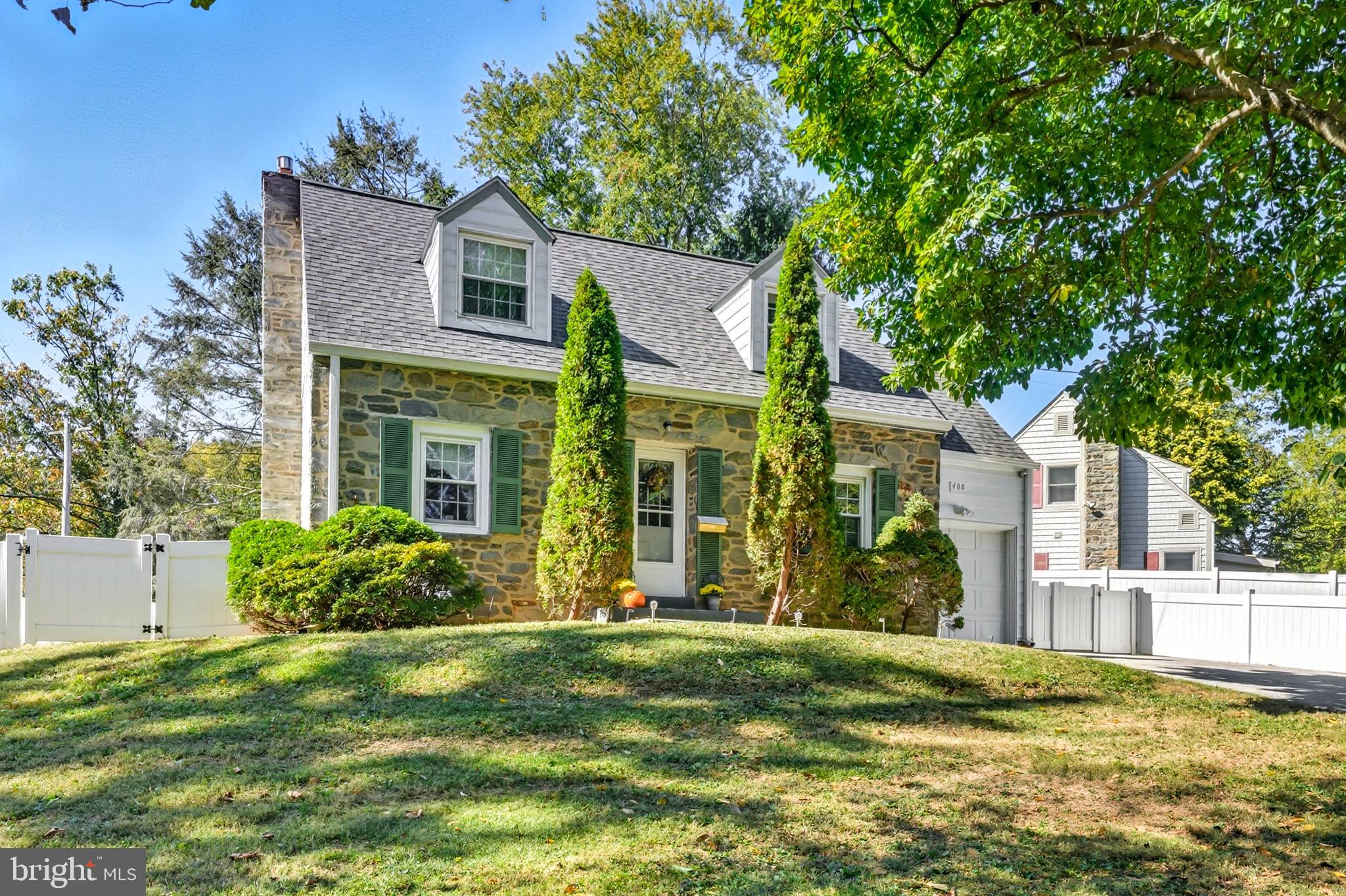 400 Witley Road Wynnewood, PA 19096 - Photo 5 of 38 a view of a house with a swimming pool