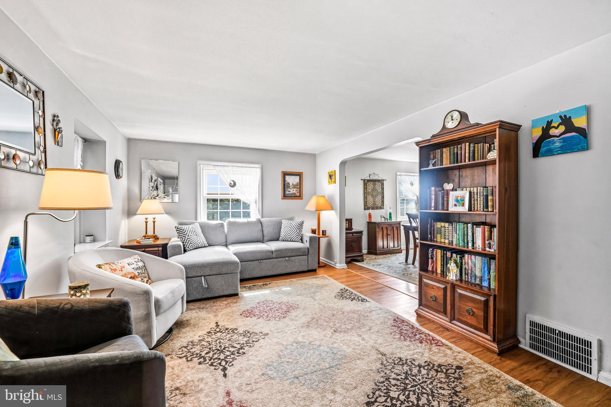 400 Witley Road Wynnewood, PA 19096 - Photo 7 of 38 a living room with furniture and a book shelf
