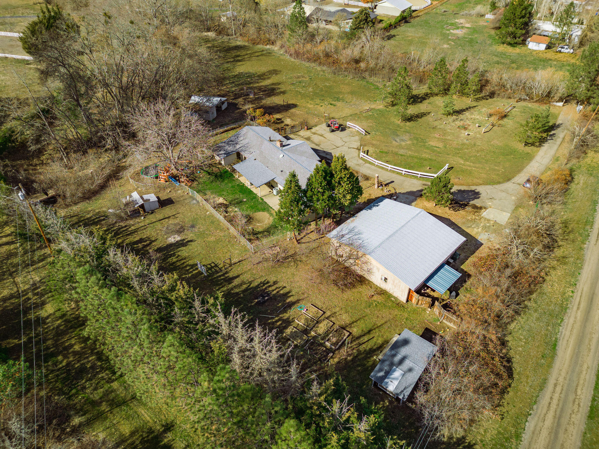 6732 Old Stage Road Central Point, OR 97502 - Photo 26 of 51 an aerial view of residential houses with outdoor space