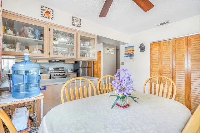 a kitchen with a stove a sink and a refrigerator