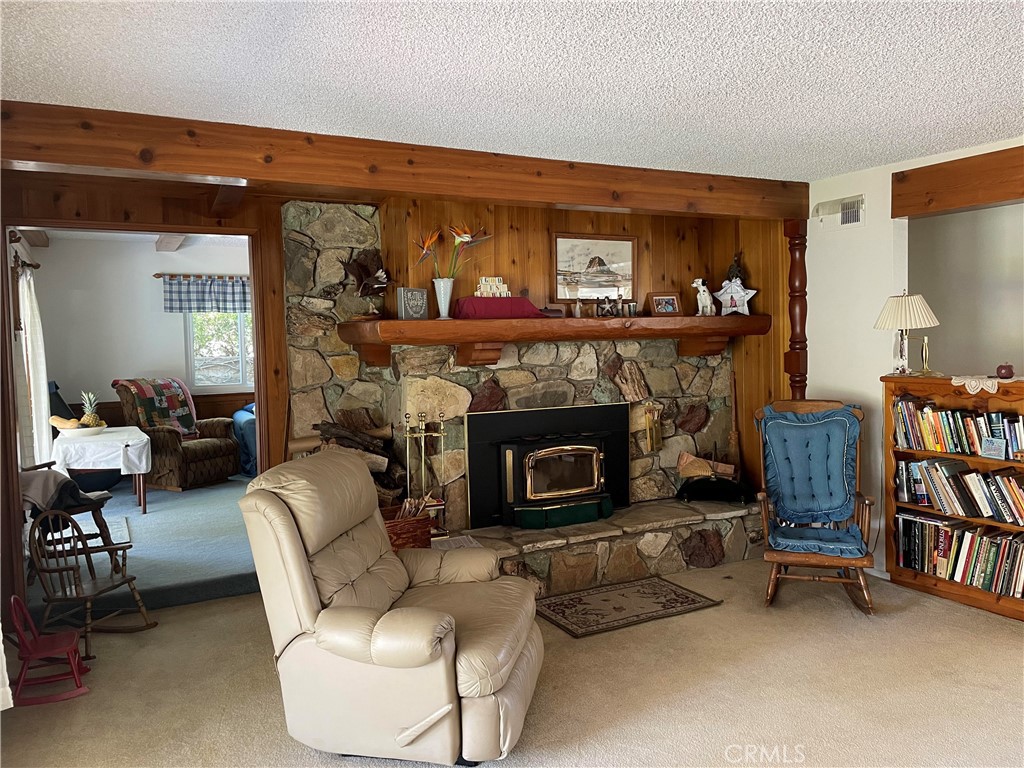 24935 Green Avenue Newhall, CA 91321 - Photo 6 of 11 a living room with furniture and a fireplace