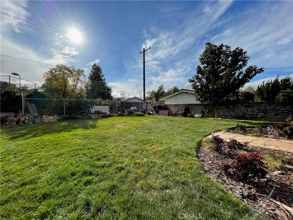 24935 Green Avenue Newhall, CA 91321 - Photo 9 of 11 a view of a house with a yard and sitting area