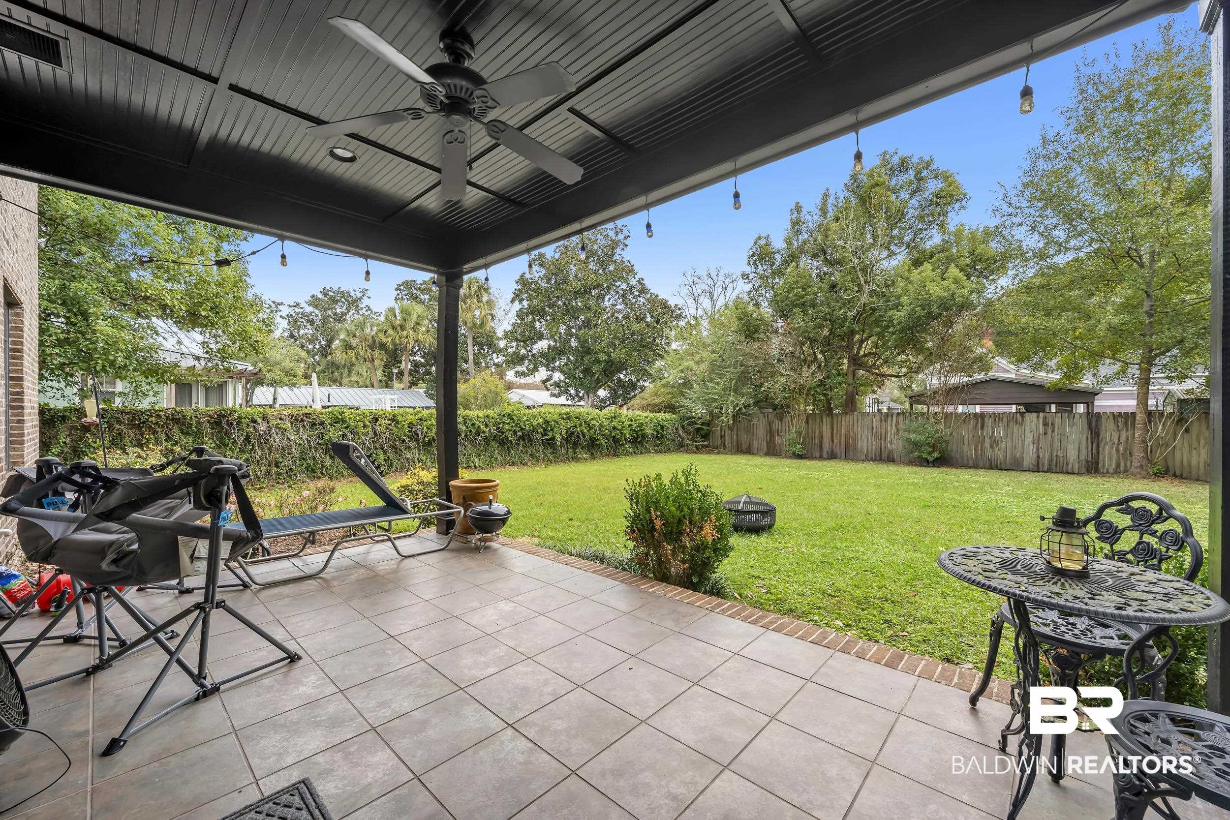 7 Bienville Avenue Mobile, AL 36606 - Photo 19 of 32 Fenced backyard with a patio area and a ceiling fan