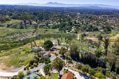 a view of a city with green field