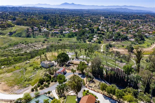 a view of a city with green field
