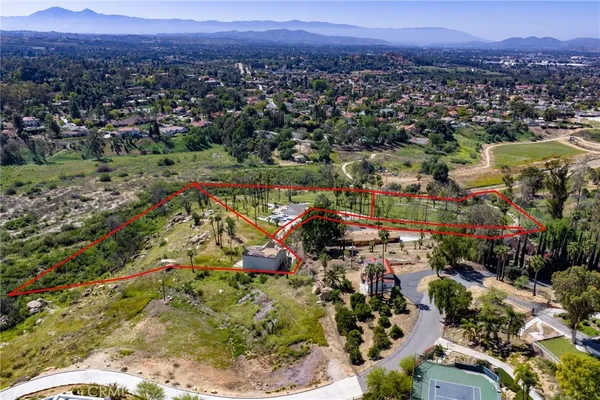 a view of a city with mountains in the background