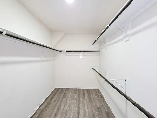 a view of small space with empty racks on the wall